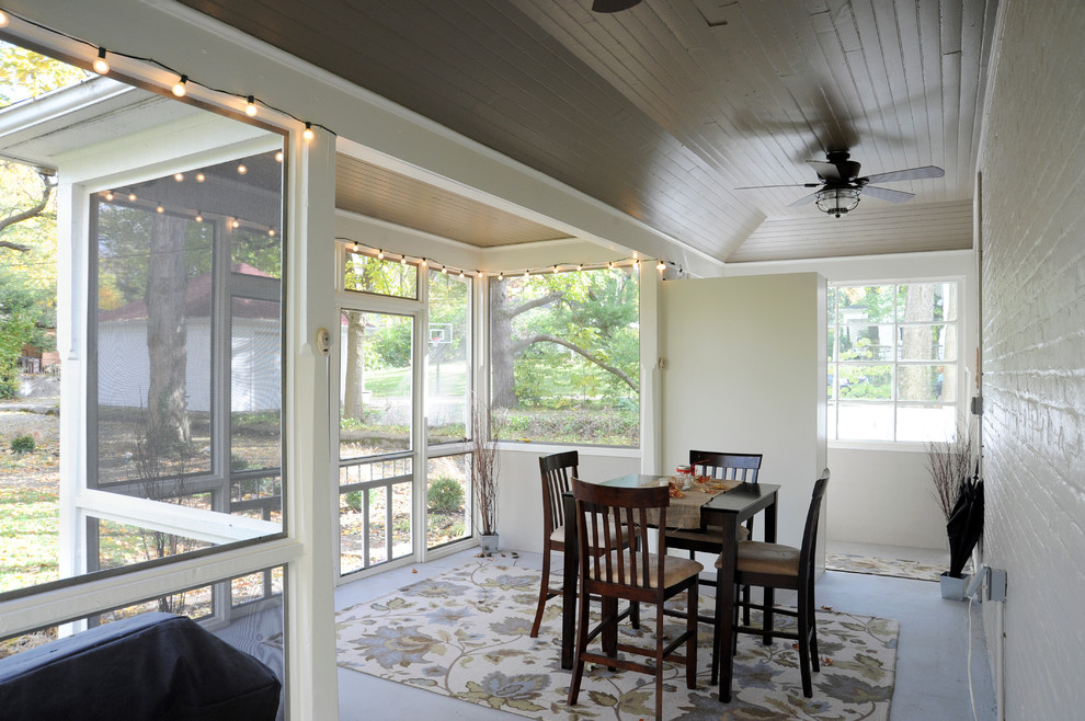 This is an example of a mid-sized traditional sunroom in Other with concrete floors, no fireplace and a standard ceiling.