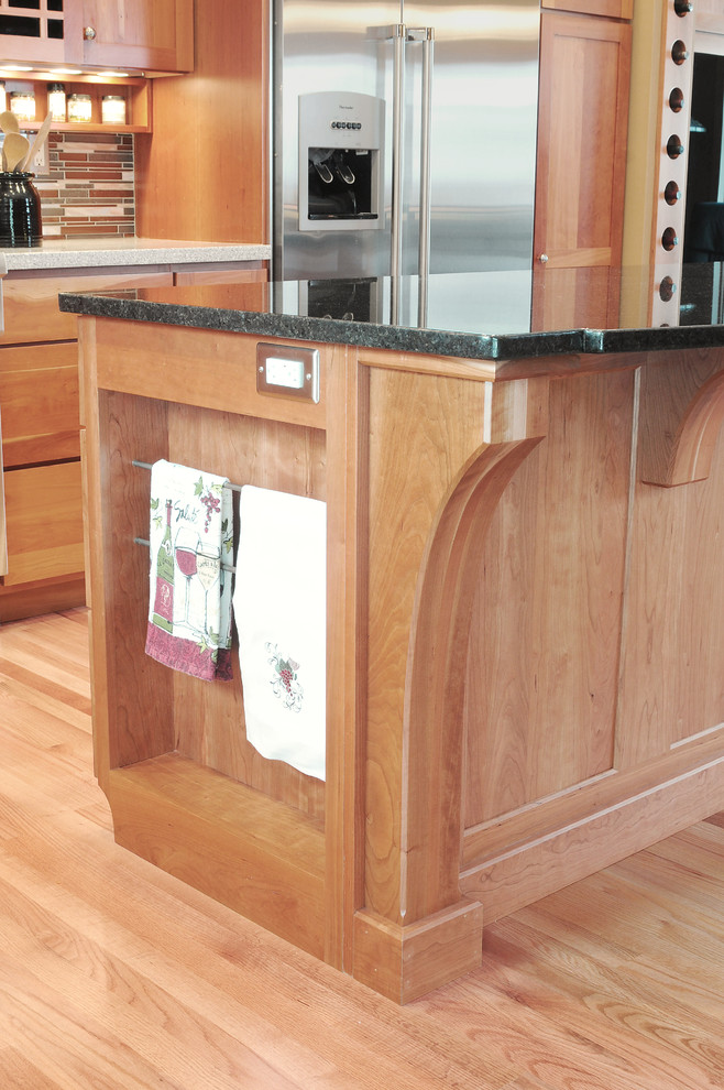 This is an example of an arts and crafts kitchen in Other with recessed-panel cabinets.