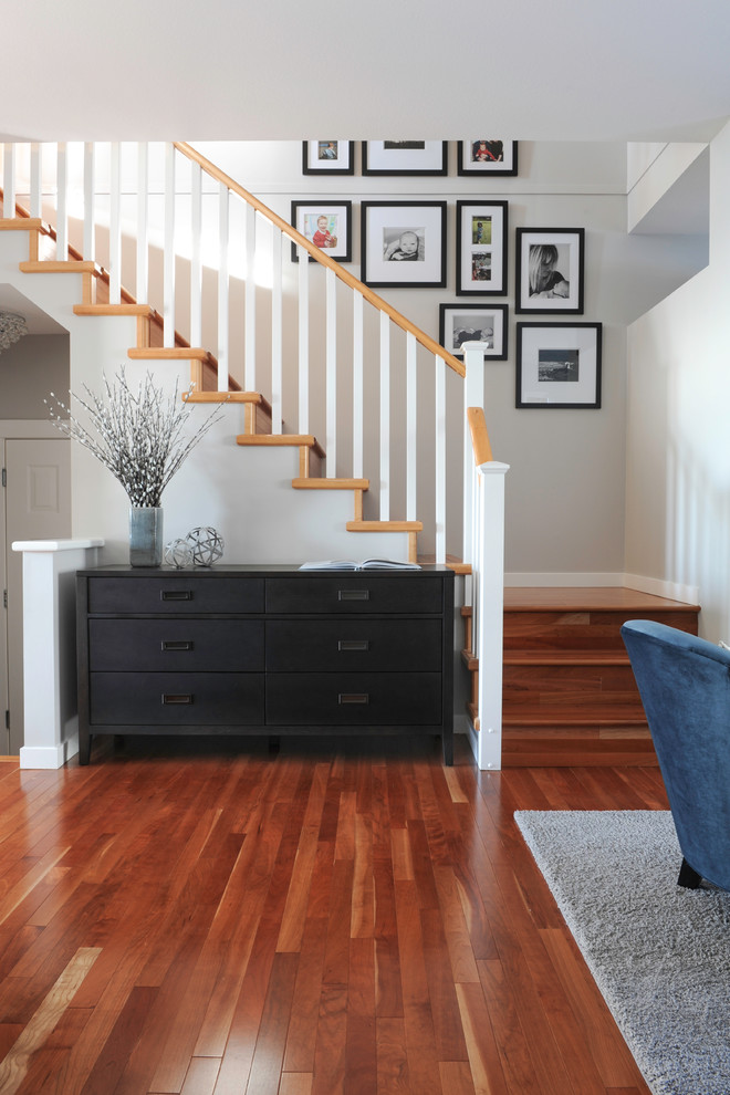 Design ideas for a small contemporary wood l-shaped staircase in Vancouver with wood risers.