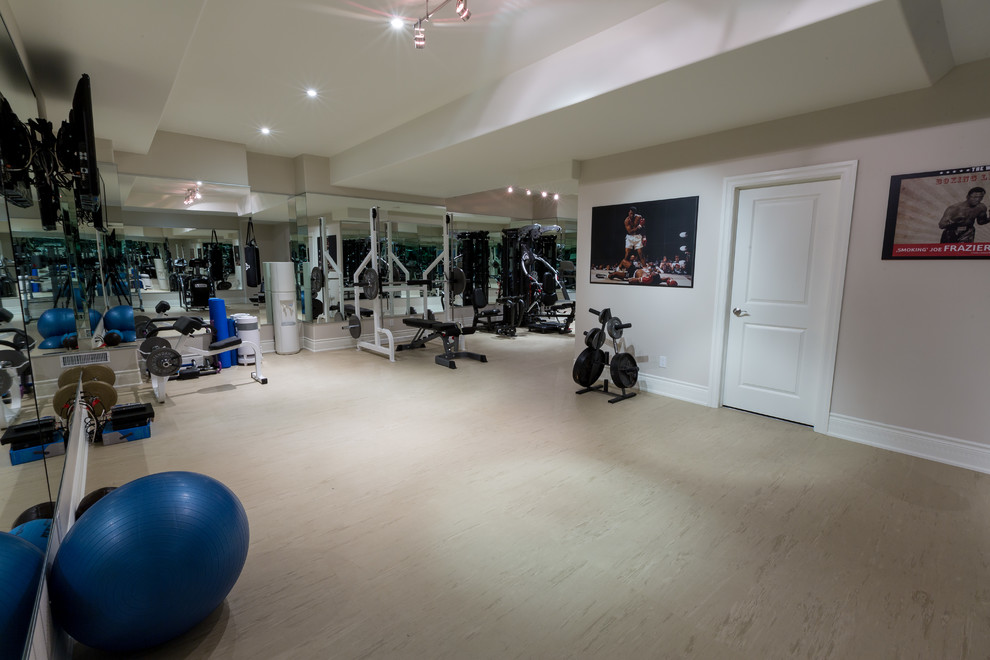 Large transitional home weight room in Toronto with beige walls, linoleum floors and beige floor.