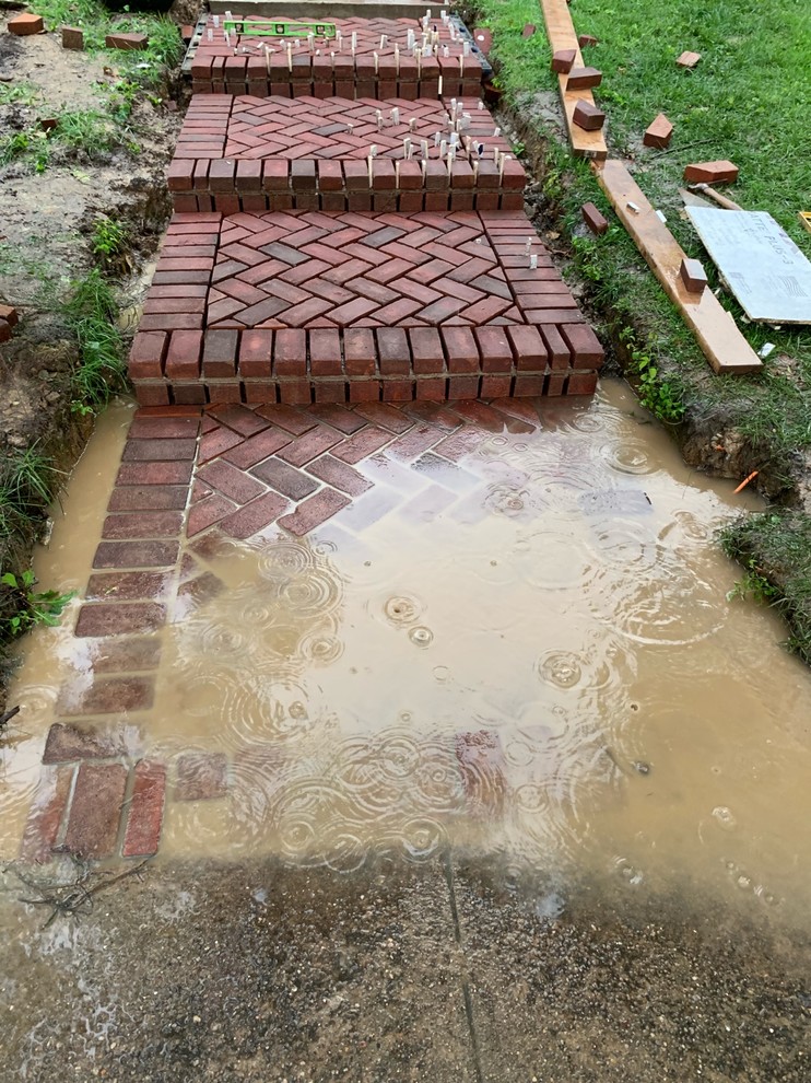 how to fix pitch issue on paver walkway?