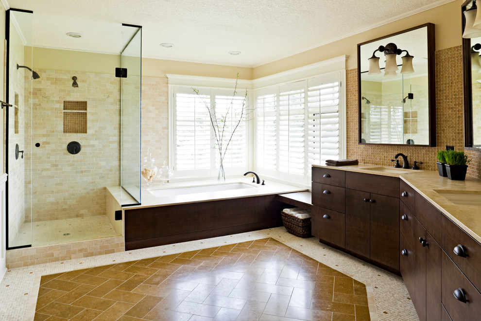 Photo of a transitional bathroom in Portland with dark wood cabinets.