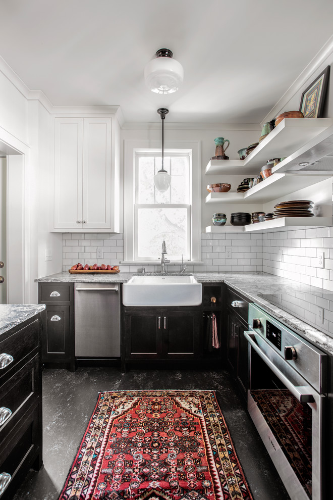 Small elegant linoleum floor and black floor enclosed kitchen photo in Minneapolis with black cabinets, granite countertops, subway tile backsplash, stainless steel appliances, a farmhouse sink, shaker cabinets, white backsplash and gray countertops