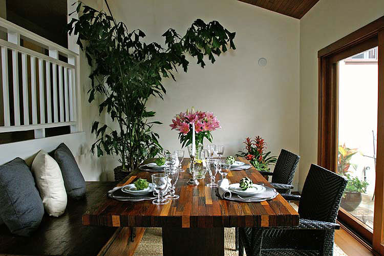 Medium sized rustic dining room in Los Angeles with white walls and medium hardwood flooring.