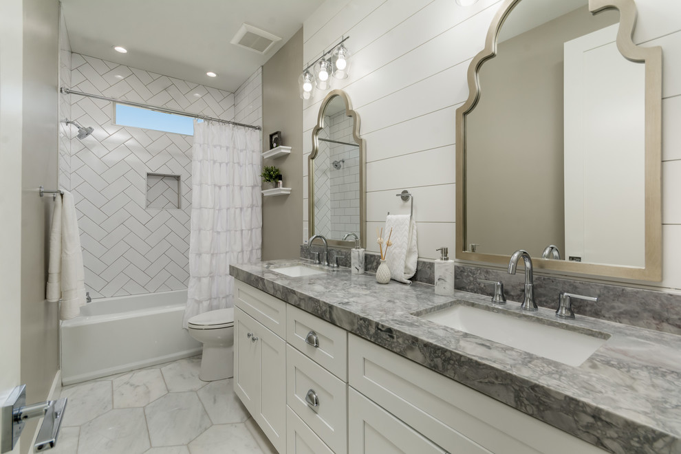 Alcove bathtub - transitional master white floor alcove bathtub idea in Phoenix with shaker cabinets, white cabinets, white walls, an undermount sink and gray countertops