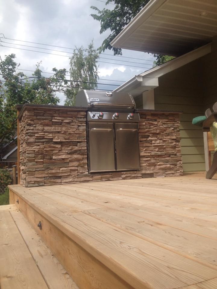 Inspiration for a mid-sized contemporary backyard outdoor kitchen deck remodel in Calgary with no cover