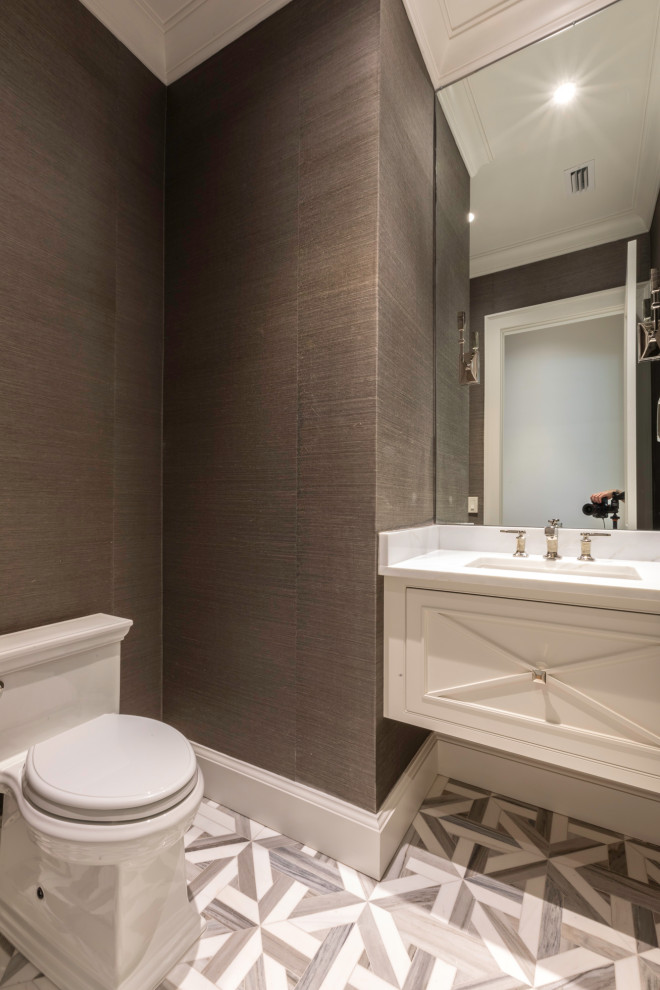 Example of a mid-sized transitional 3/4 porcelain tile and white floor bathroom design in Orlando with raised-panel cabinets, white cabinets, a two-piece toilet, gray walls, an undermount sink, quartzite countertops and white countertops