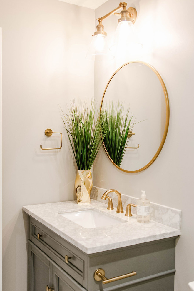 Design ideas for a small transitional 3/4 bathroom in Omaha with furniture-like cabinets, grey cabinets, an alcove shower, a two-piece toilet, white tile, subway tile, beige walls, an undermount sink, marble benchtops, white floor, a sliding shower screen and white benchtops.