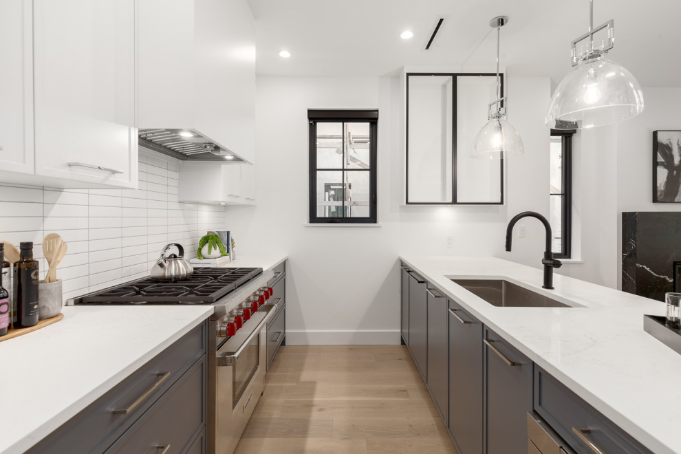 Example of a transitional kitchen design in Vancouver