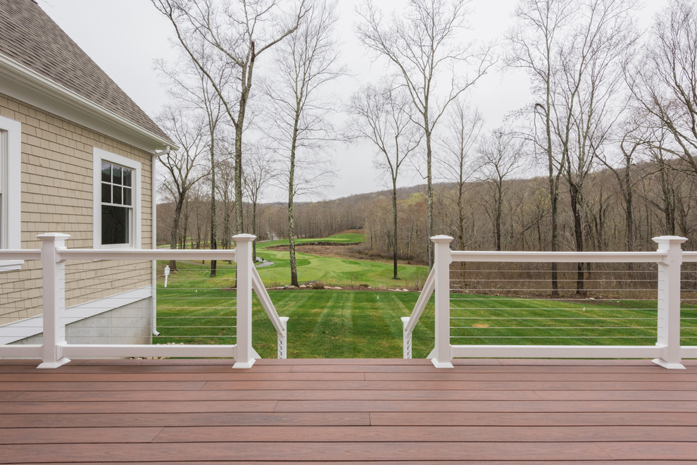 Inspiration for a mid-sized traditional backyard deck in Bridgeport with no cover and cable railing.
