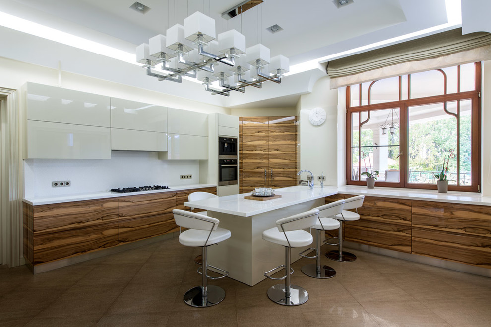 Large contemporary u-shaped separate kitchen in Moscow with an integrated sink, flat-panel cabinets, medium wood cabinets, solid surface benchtops, white splashback, stainless steel appliances, ceramic floors and a peninsula.