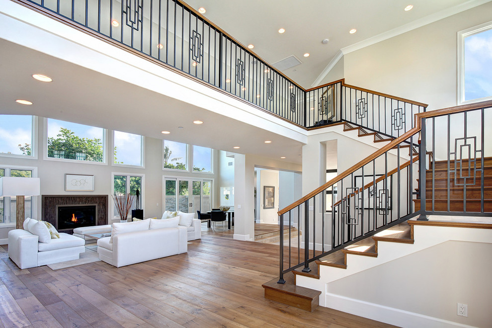 Photo of a transitional wood staircase in Orange County with wood risers and mixed railing.