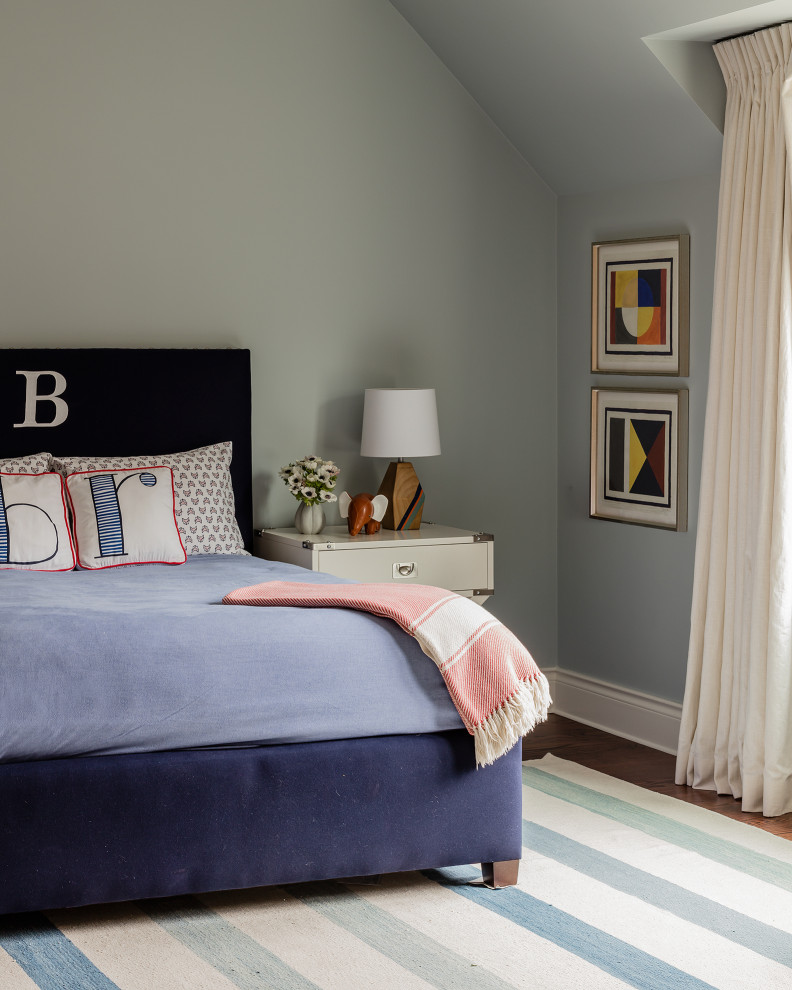 Design ideas for a large transitional guest bedroom in Boston with blue walls, dark hardwood floors, no fireplace and brown floor.