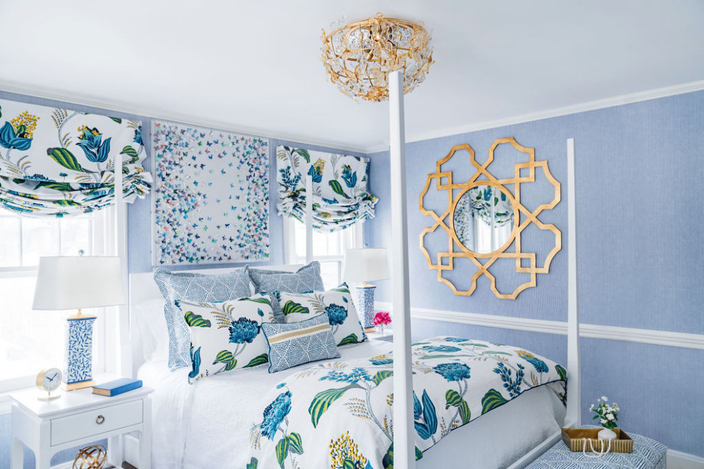 Inspiration for a medium sized classic guest bedroom in Cincinnati with blue walls, medium hardwood flooring, no fireplace, brown floors and wallpapered walls.