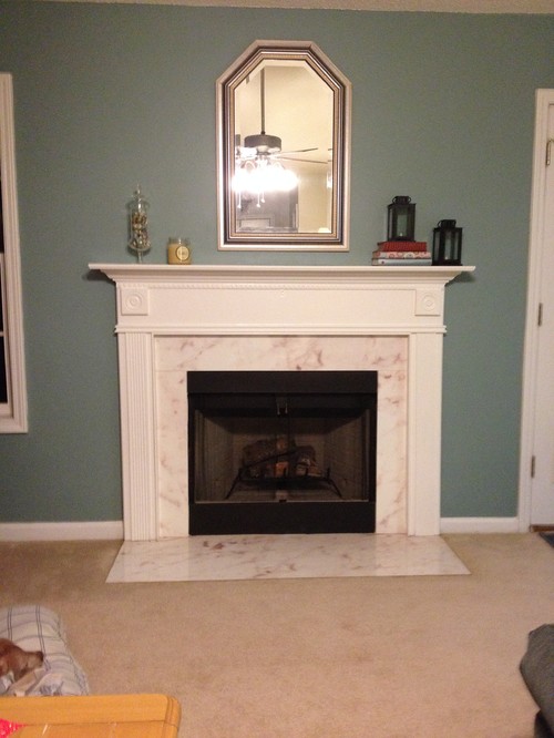 Need help with fireplace renovation. Remove surround one piece. Home built 2001. Fireplace is prefab one piece. The "marble" around firebox is actually concrete with a faux marble treatment on top. its starting to bubble n peel. I want to demo everything but firebox