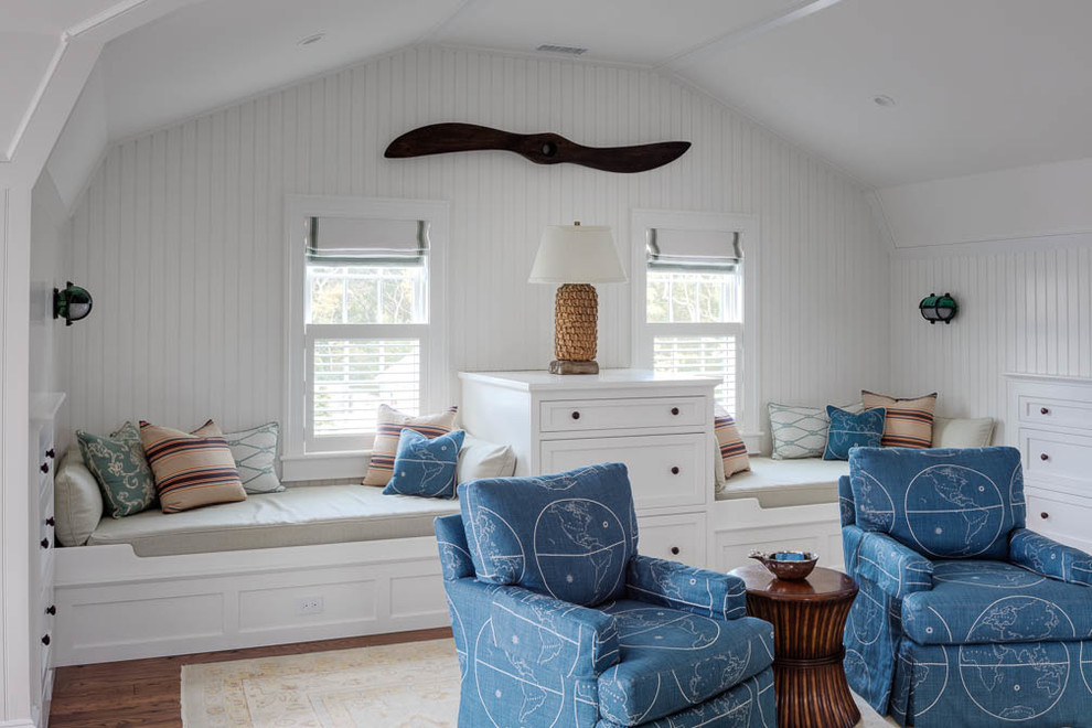 Inspiration for a mid-sized beach style gender-neutral kids' bedroom for kids 4-10 years old in Boston with white walls and medium hardwood floors.