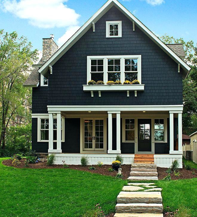 Mid-sized arts and crafts two-storey black house exterior in Salt Lake City with wood siding, a gable roof and a shingle roof.