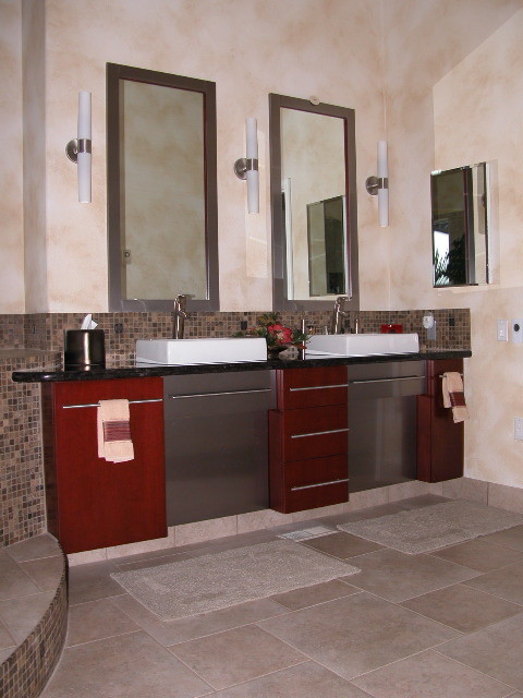 Bathroom - mid-sized transitional master brown tile and mosaic tile ceramic tile and gray floor bathroom idea with flat-panel cabinets, red cabinets, beige walls, a vessel sink and quartz countertops