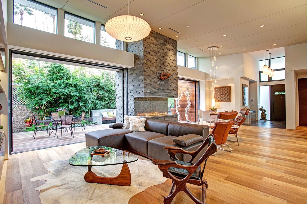 This is an example of a contemporary formal open concept living room in San Diego.