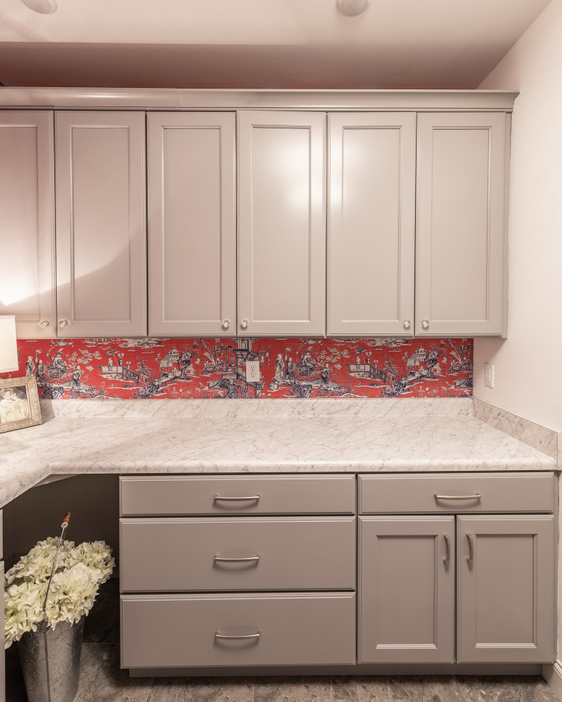 This is an example of a mid-sized traditional u-shaped dedicated laundry room in Other with a drop-in sink, recessed-panel cabinets, beige cabinets, laminate benchtops, red walls, porcelain floors, a side-by-side washer and dryer, beige floor and beige benchtop.