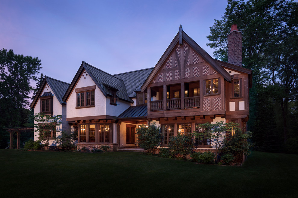 Design ideas for an expansive traditional three-storey exterior in Milwaukee.