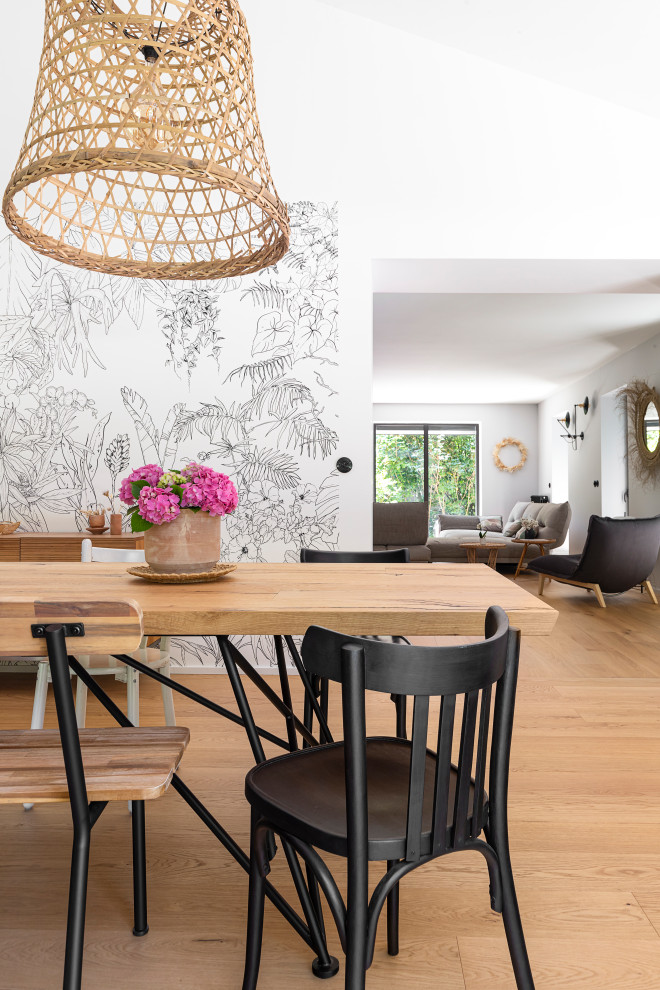 Design ideas for a large eclectic open plan dining in Lyon with light hardwood floors and recessed.