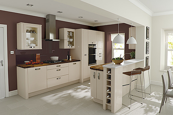 Inspiration for a contemporary galley eat-in kitchen in Surrey with beige cabinets, wood benchtops, red splashback, stainless steel appliances and a peninsula.