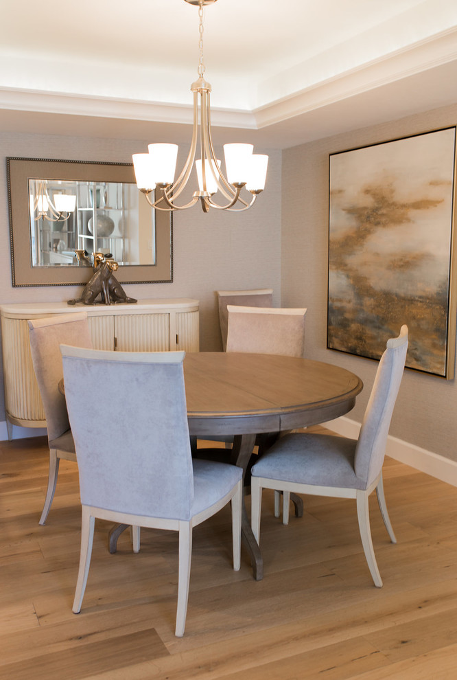 Dining room - small transitional medium tone wood floor and brown floor dining room idea in Miami