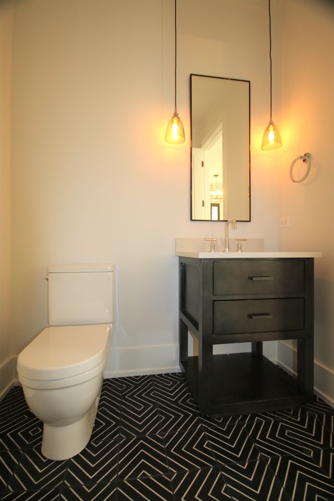 Inspiration for a mid-sized modern powder room in Chicago with flat-panel cabinets, dark wood cabinets, beige walls, an undermount sink, a one-piece toilet, ceramic floors, concrete benchtops, multi-coloured floor and white benchtops.