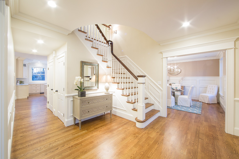 Design ideas for a beach style foyer in Boston with beige walls and medium hardwood floors.