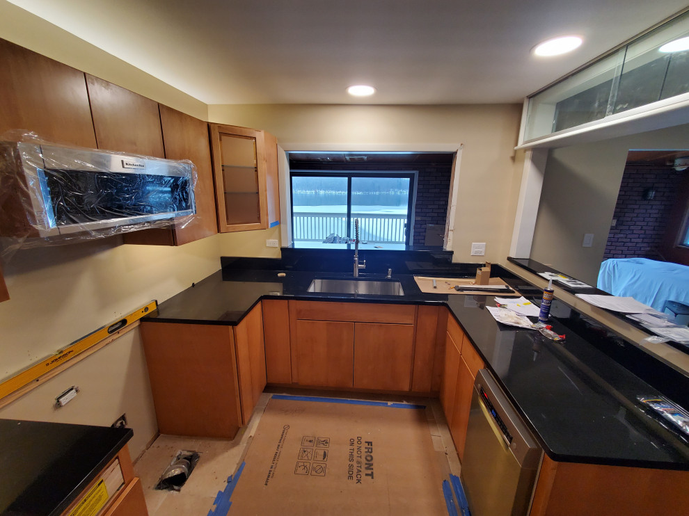 Kitchen remodel with newly installed black granite tops