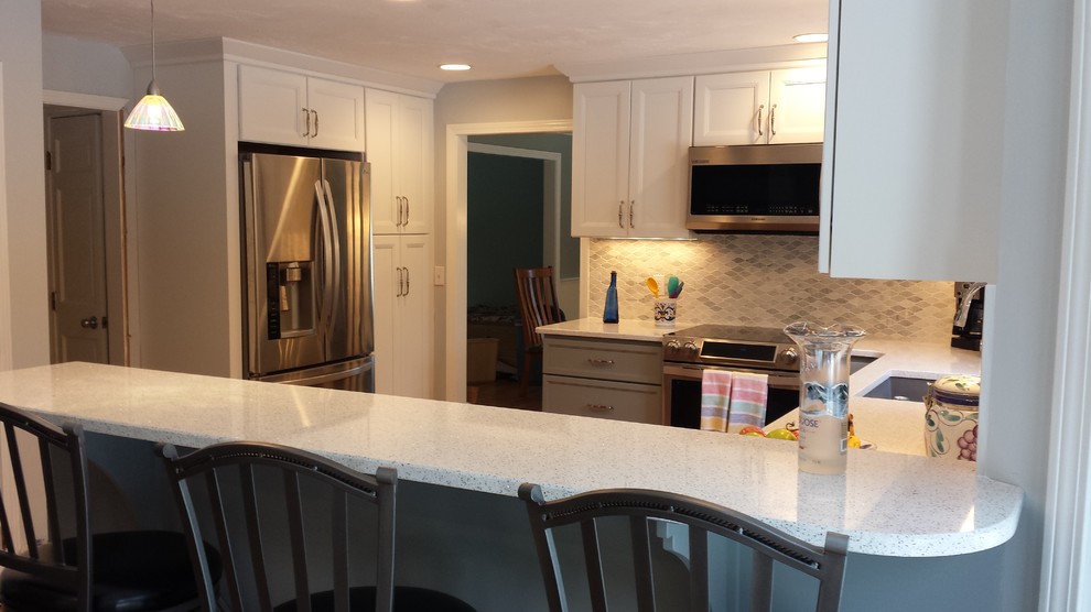 Mid-sized transitional u-shaped kitchen photo in Boston with gray cabinets, quartz countertops, gray backsplash, mosaic tile backsplash, stainless steel appliances and a peninsula