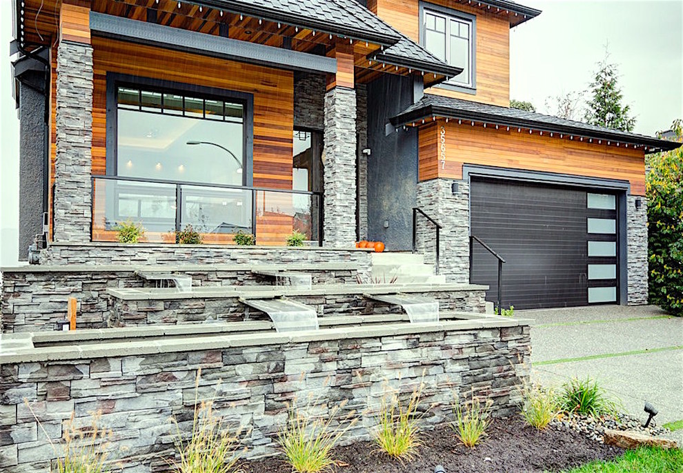 Mid-sized contemporary three-storey brown exterior in Vancouver with wood siding and a hip roof.