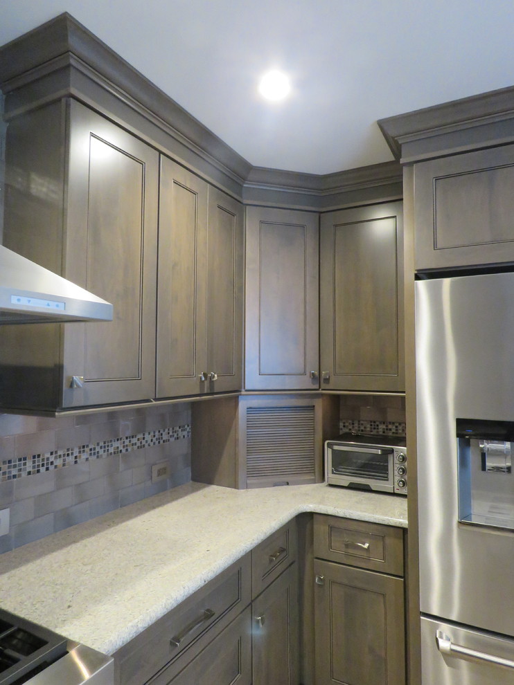 Inspiration for a mid-sized transitional u-shaped ceramic tile and beige floor eat-in kitchen remodel in Philadelphia with an undermount sink, shaker cabinets, gray cabinets, quartzite countertops, gray backsplash, subway tile backsplash, stainless steel appliances and an island