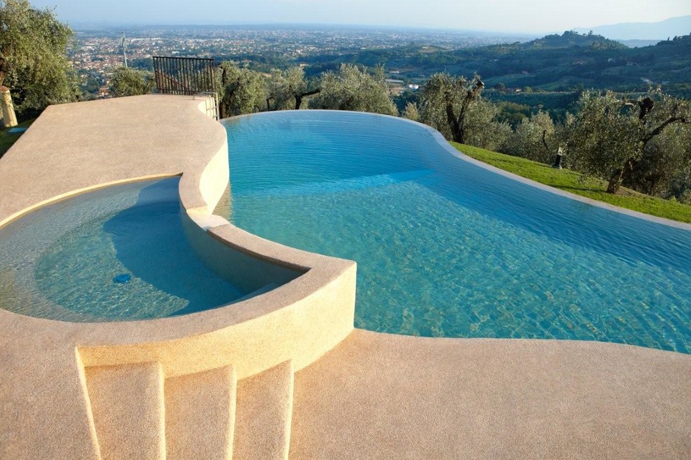 Country pool in Other with concrete pavers.