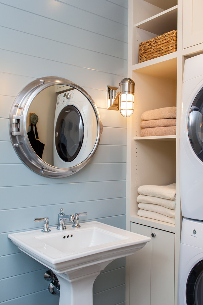 Beach style bathroom in Boston with a pedestal sink, blue walls and a laundry.
