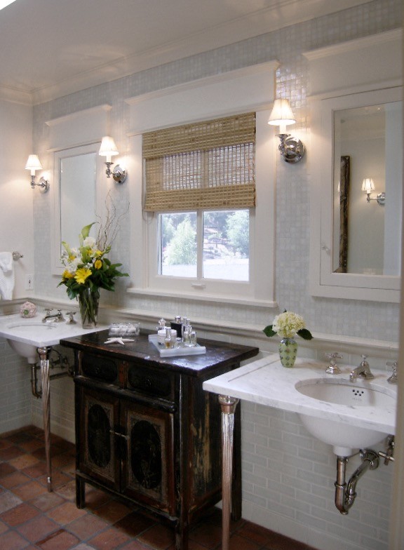 Inspiration for a mid-sized traditional master bathroom in Los Angeles with a pedestal sink, dark wood cabinets, marble benchtops, an undermount tub, an alcove shower, a two-piece toilet, green tile, mosaic tile, white walls and terra-cotta floors.