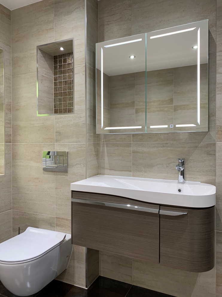 Large minimalist kids' beige tile and porcelain tile porcelain tile, brown floor and single-sink bathroom photo in London with flat-panel cabinets, medium tone wood cabinets, a wall-mount toilet, beige walls, an integrated sink and a floating vanity