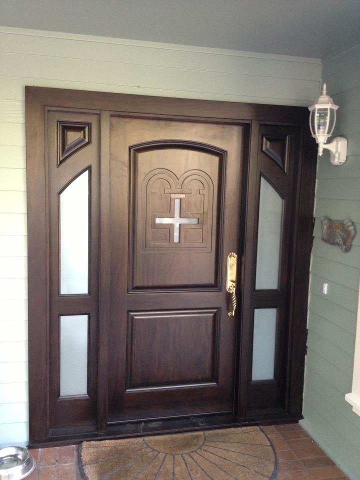 This is an example of a mid-sized transitional front door in San Francisco with grey walls, brick floors, a single front door and a dark wood front door.
