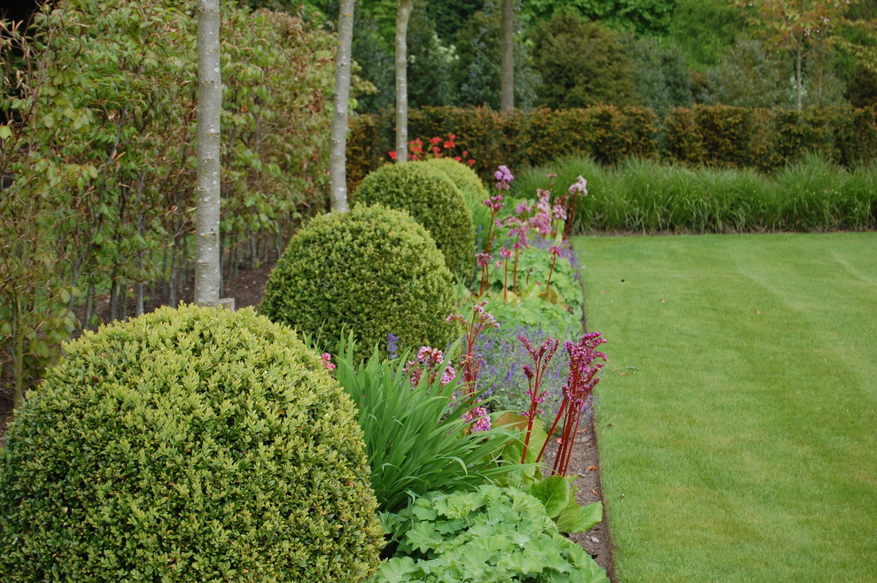 Photo of a transitional garden in Cheshire.
