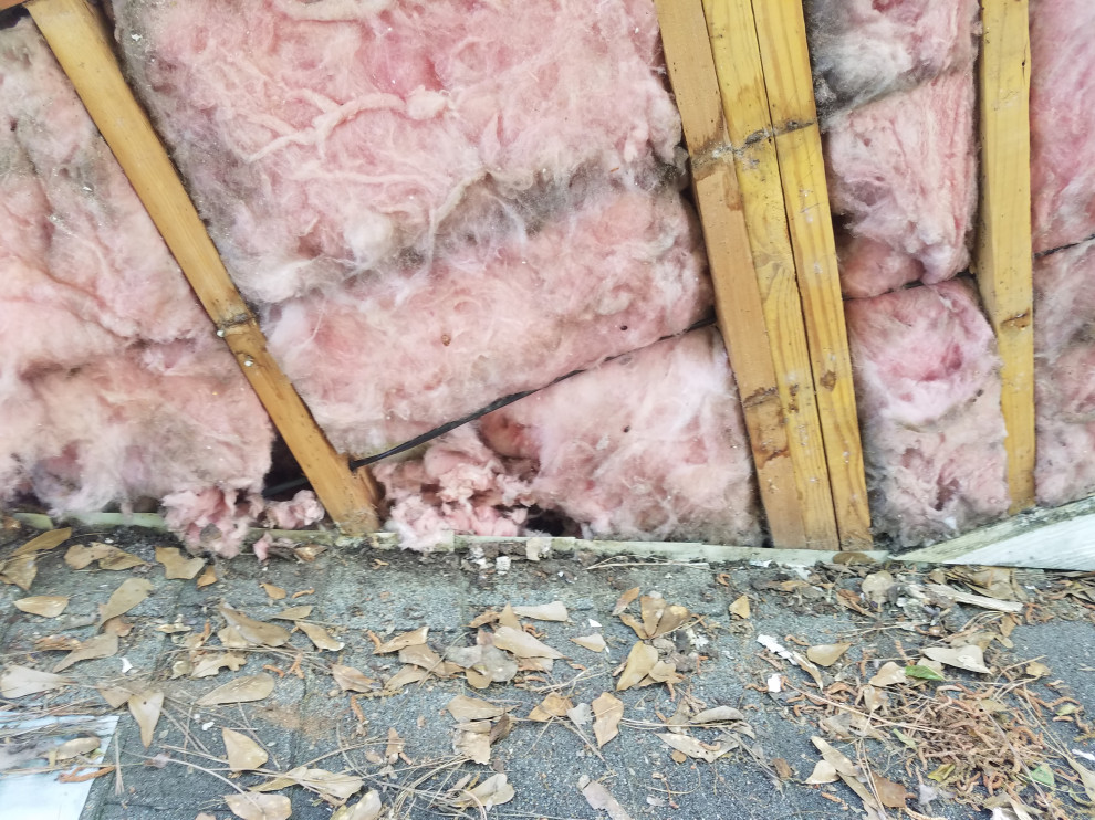 Roof step flashing that was cut because the siding was too close to the roof line