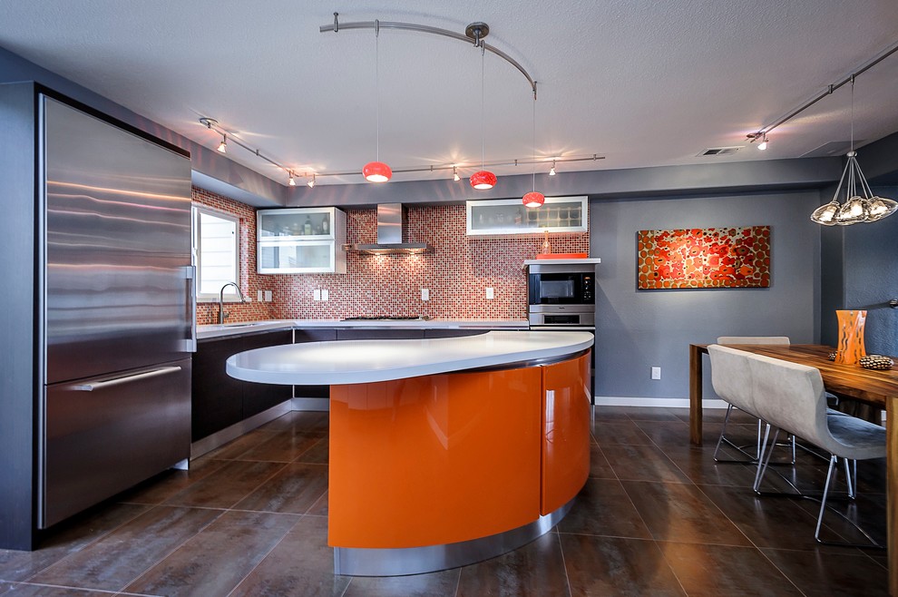 This is an example of a mid-sized contemporary l-shaped eat-in kitchen in San Francisco with flat-panel cabinets, black cabinets, orange splashback, mosaic tile splashback, stainless steel appliances, quartz benchtops and with island.