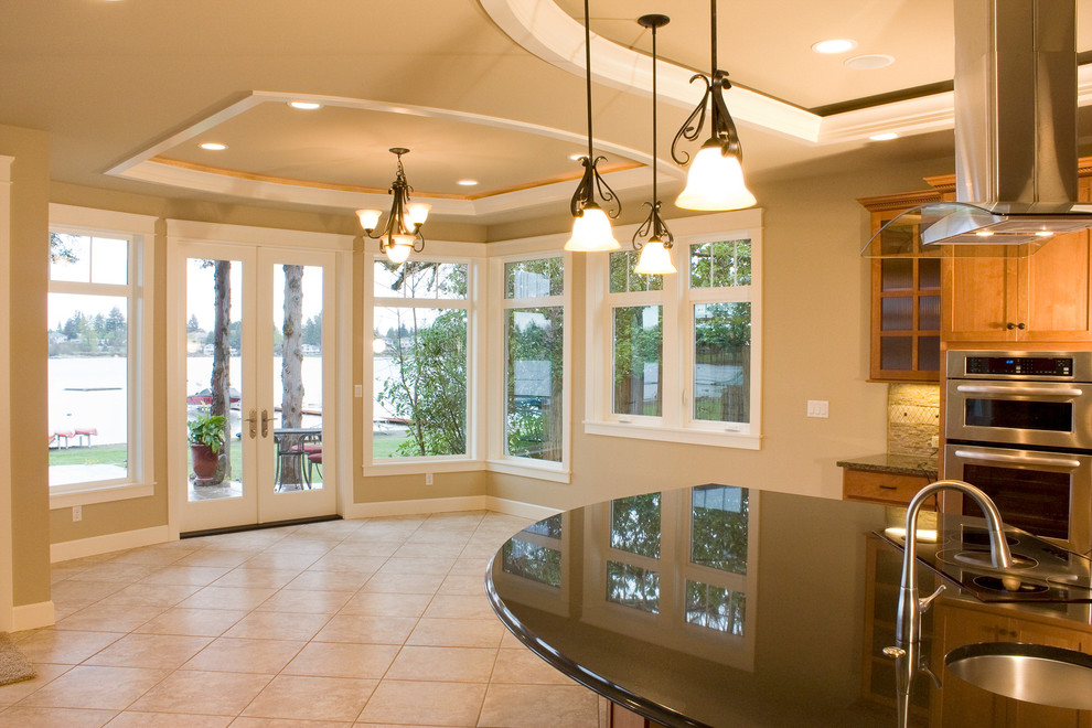 Design ideas for a large traditional open plan dining in Seattle with beige walls and ceramic floors.