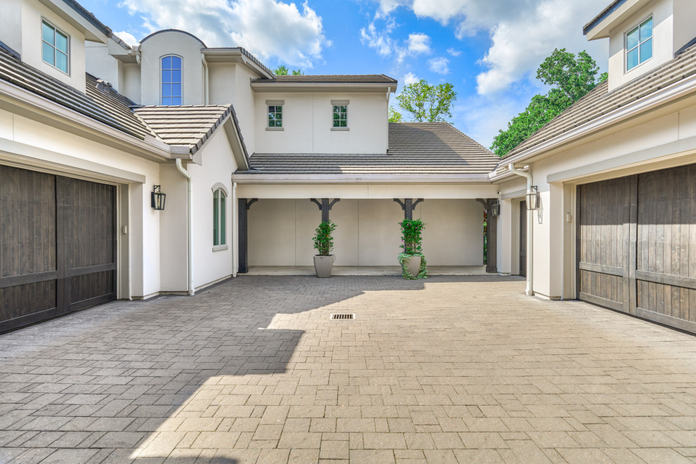Example of a transitional garage design in Houston