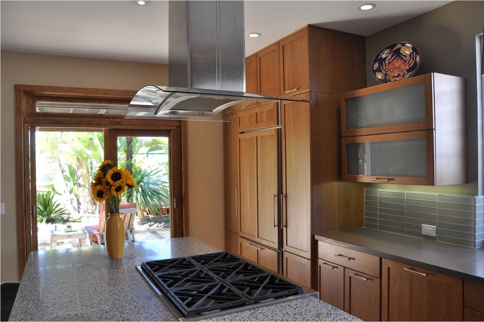 Inspiration for a mid-sized midcentury l-shaped open plan kitchen in San Diego with an undermount sink, shaker cabinets, medium wood cabinets, terrazzo benchtops, grey splashback, matchstick tile splashback, panelled appliances, ceramic floors, with island and beige floor.