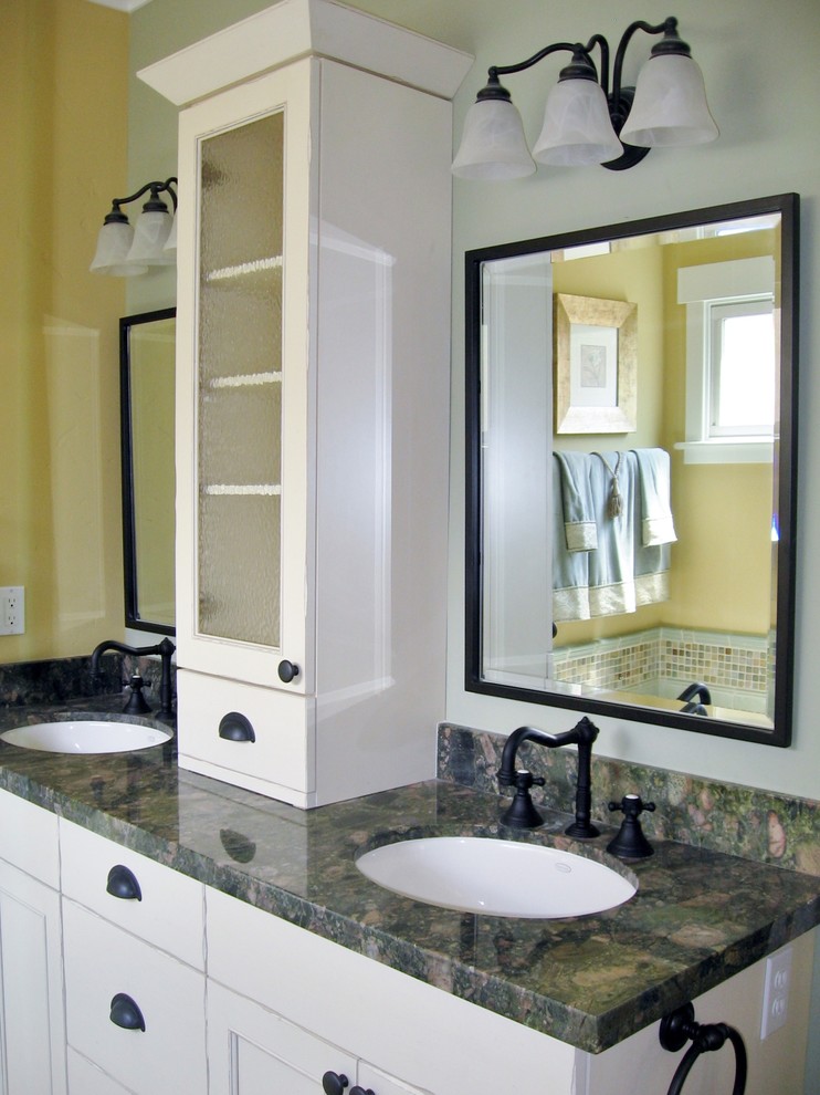 Inspiration for a mid-sized traditional master bathroom in San Francisco with an undermount sink, recessed-panel cabinets, distressed cabinets, granite benchtops and yellow walls.