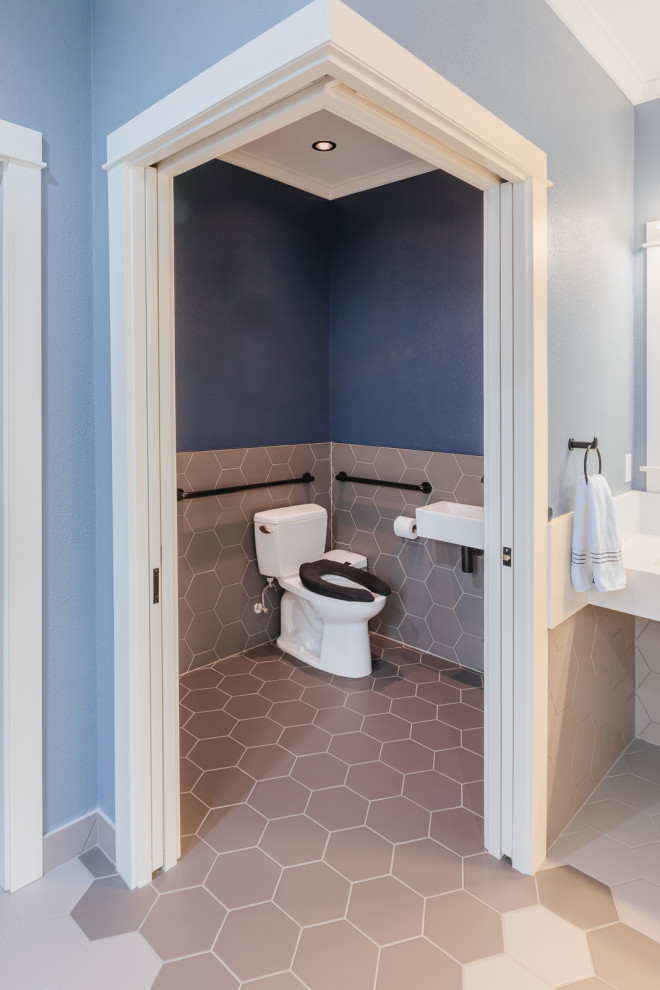 Photo of a large traditional master bathroom in Portland with flat-panel cabinets, white cabinets, a curbless shower, blue walls, porcelain floors, grey floor, an open shower, white benchtops, an enclosed toilet, a double vanity and a built-in vanity.
