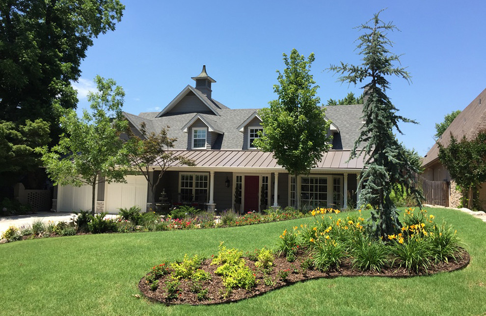 Example of a large transitional gray two-story mixed siding exterior home design