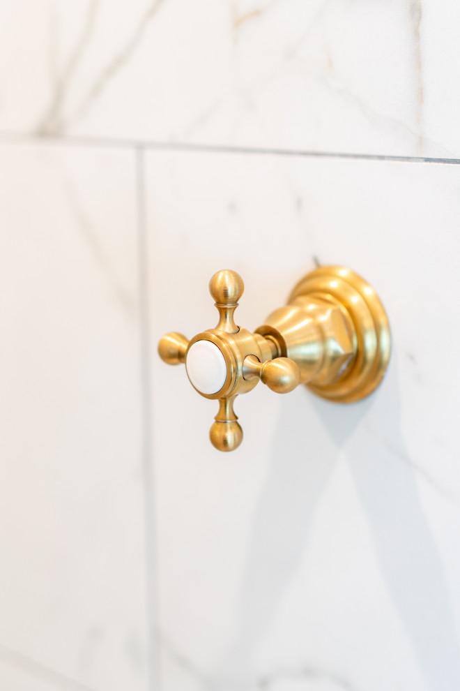 Golden Shower Head in Modern Bathroom with Tiled Walls