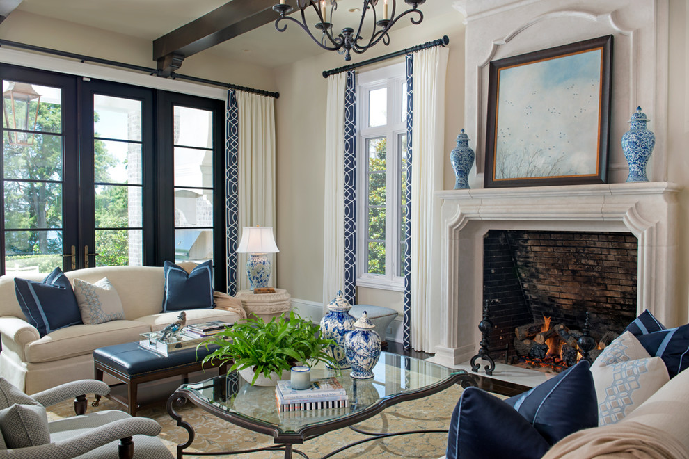 Large elegant carpeted living room photo in Orlando with white walls, a standard fireplace, a stone fireplace and no tv